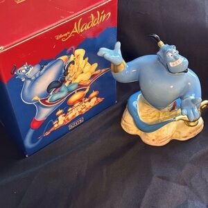 Schmid Disney’s Alladdin Gene musical box figurine measures about 5” tall.